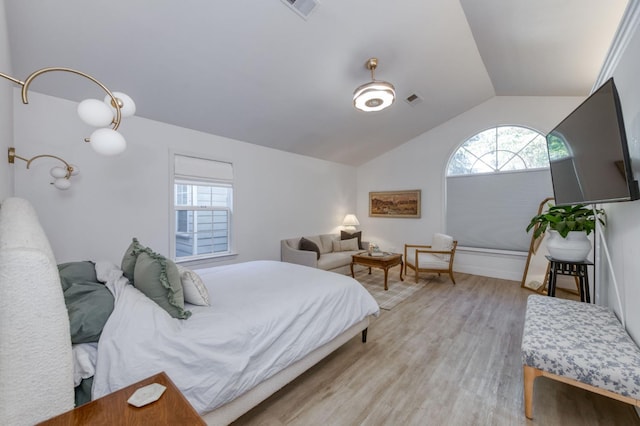 3519 N Van Ness Blvd, Fresno, CA 93704 - bedroom featuring lofted ceiling, multiple windows, light wood-style floors, and baseboards