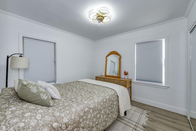3519 N Van Ness Blvd, Fresno, CA 93704 - bedroom featuring crown molding, wood finished floors, and baseboards