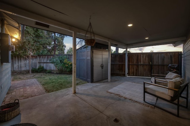 3519 N Van Ness Blvd, Fresno, CA 93704 - view of patio featuring a fenced backyard, an outdoor structure, and a shed