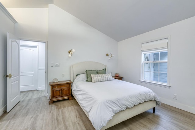 3519 N Van Ness Blvd, Fresno, CA 93704 - bedroom with light wood-style floors, baseboards, and lofted ceiling