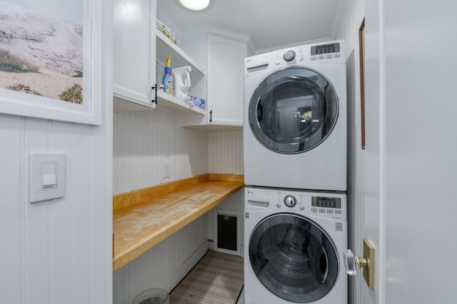3519 N Van Ness Blvd, Fresno, CA 93704 - clothes washing area with stacked washer and clothes dryer and cabinet space