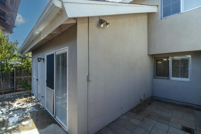 5455 N Marty Ave Unit 132, Fresno, CA 93711 - view of side of home with stucco siding, fence, and a patio