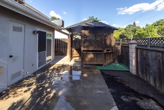 view of patio / terrace featuring fence