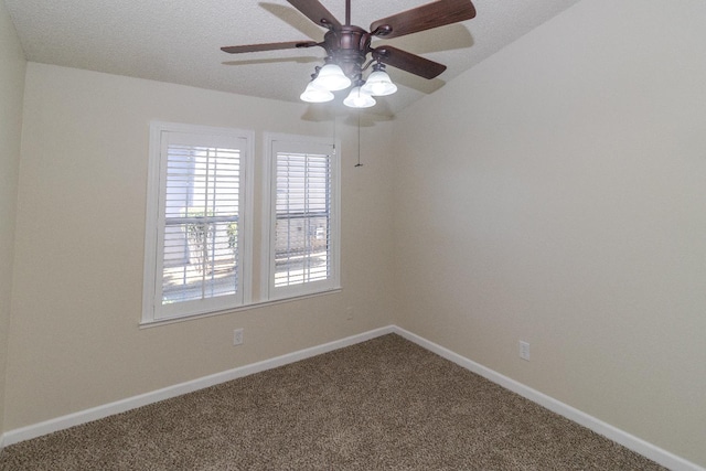 spare room featuring carpet, a ceiling fan, and baseboards