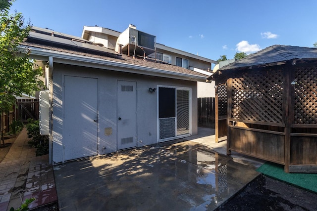 5455 N Marty Ave Unit 132, Fresno, CA 93711 - back of property featuring a patio area, solar panels, and fence