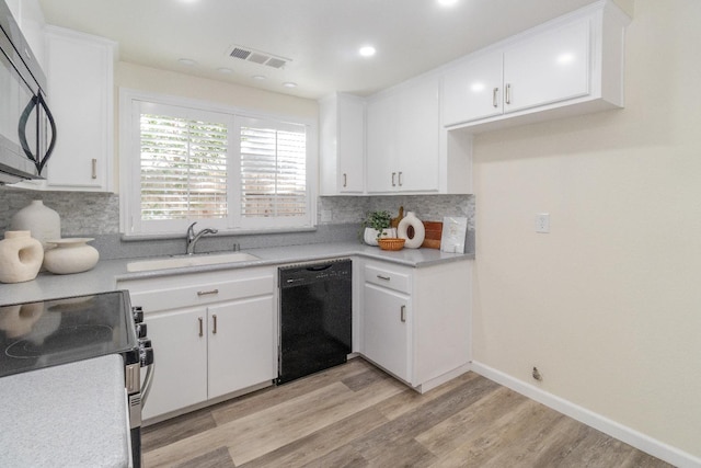 5455 N Marty Ave Unit 132, Fresno, CA 93711 - kitchen featuring black appliances, a sink, decorative backsplash, light countertops, and white cabinets