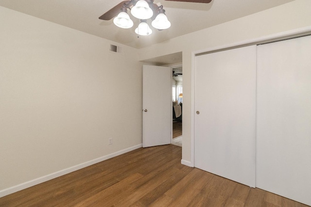 5455 N Marty Ave Unit 132, Fresno, CA 93711 - unfurnished bedroom featuring wood finished floors, a closet, baseboards, and ceiling fan