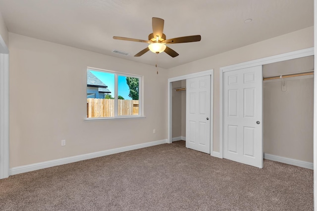 35 E Florence Ave, Fresno, CA 93706 - unfurnished bedroom featuring multiple closets, carpet, baseboards, and a ceiling fan
