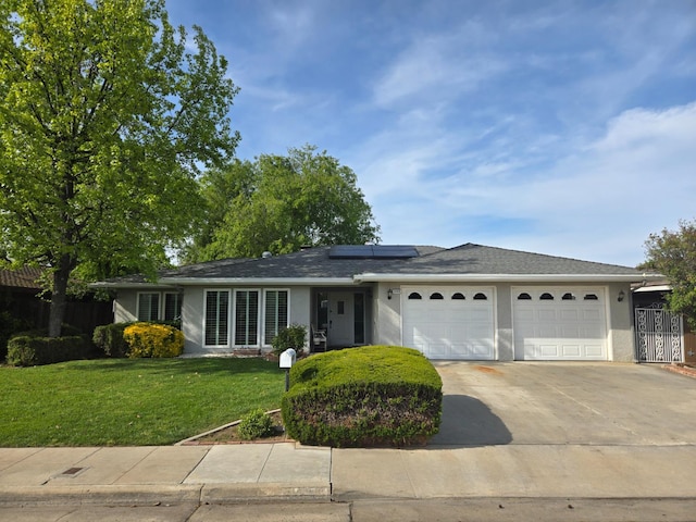 1489 Celeste Ave, Clovis, CA 93611 - ranch-style house with a garage, driveway, solar panels, and stucco siding