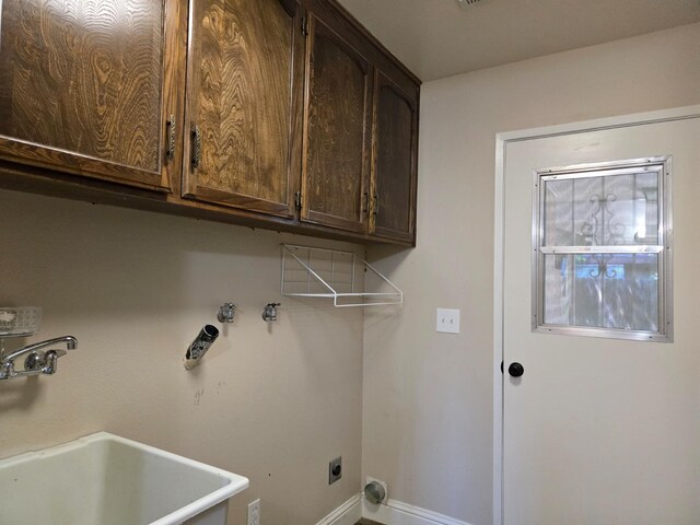 1489 Celeste Ave, Clovis, CA 93611 - clothes washing area featuring cabinet space, baseboards, and electric dryer hookup