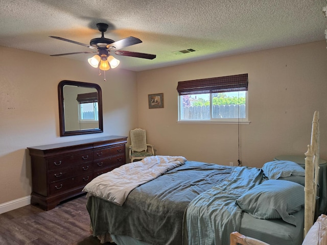 1489 Celeste Ave, Clovis, CA 93611 - bedroom with dark wood-style floors, a textured ceiling, baseboards, and a ceiling fan