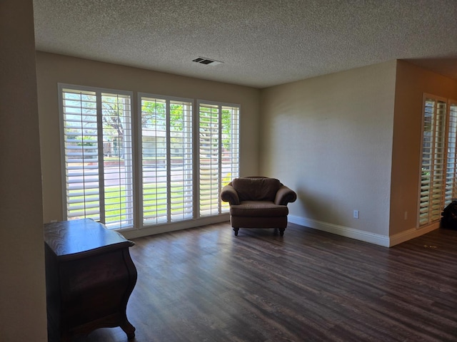 1489 Celeste Ave, Clovis, CA 93611 - sitting room featuring dark wood finished floors, a textured ceiling, and baseboards