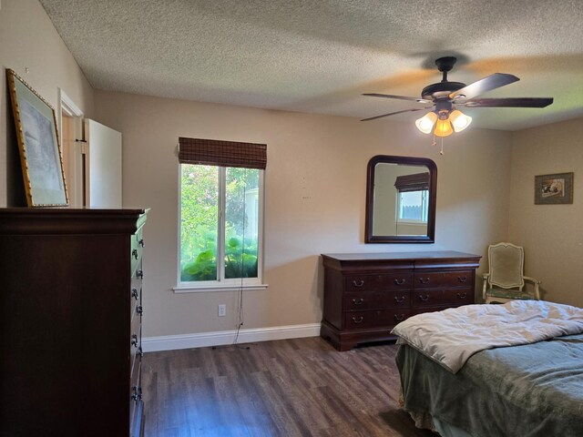1489 Celeste Ave, Clovis, CA 93611 - bedroom featuring dark wood finished floors, a textured ceiling, baseboards, and a ceiling fan