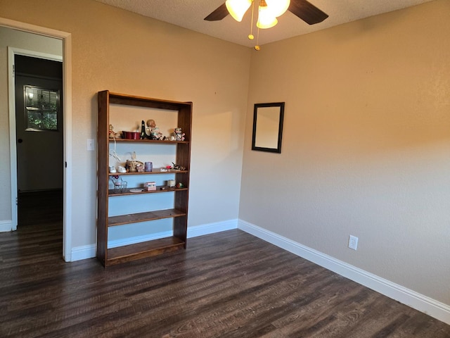1489 Celeste Ave, Clovis, CA 93611 - empty room featuring a ceiling fan, dark wood-style floors, and baseboards