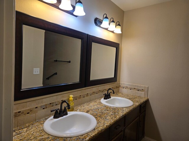 1489 Celeste Ave, Clovis, CA 93611 - bathroom featuring tasteful backsplash and double vanity