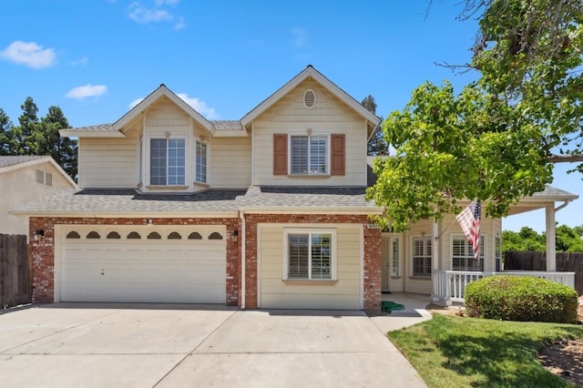 traditional-style home featuring brick siding, concrete driveway, roof with shingles, and fence