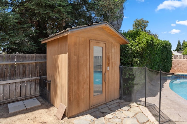 view of shed featuring a fenced backyard