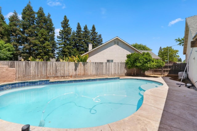 view of swimming pool featuring a fenced backyard