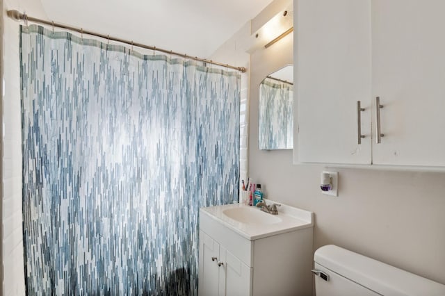 2140 E Floradora Ave, Fresno, CA 93703 - bathroom with toilet, vanity, and a shower with shower curtain