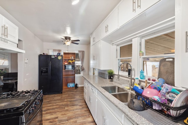 2140 E Floradora Ave, Fresno, CA 93703 - kitchen featuring appliances with stainless steel finishes, under cabinet range hood, a sink, wood finished floors, and a ceiling fan