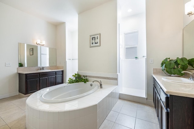 5279 N Ensanada Ave, Fresno, CA 93723 - bathroom featuring a garden tub, tile patterned floors, and two vanities