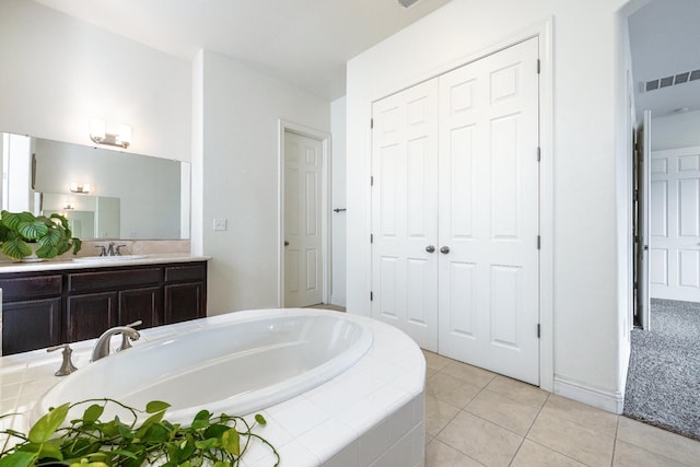 5279 N Ensanada Ave, Fresno, CA 93723 - full bathroom featuring a garden tub, vanity, and tile patterned flooring