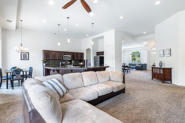 5279 N Ensanada Ave, Fresno, CA 93723 - living area featuring a chandelier, light carpet, recessed lighting, a ceiling fan, and baseboards