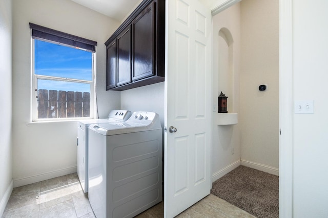 5279 N Ensanada Ave, Fresno, CA 93723 - clothes washing area with washing machine and clothes dryer, cabinet space, and baseboards