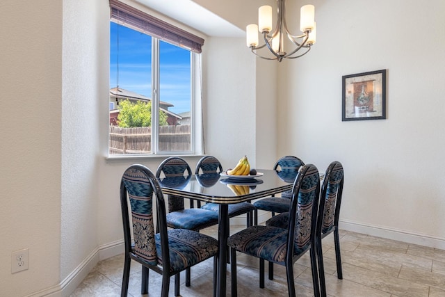 5279 N Ensanada Ave, Fresno, CA 93723 - dining area with a chandelier and baseboards