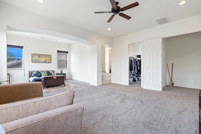5279 N Ensanada Ave, Fresno, CA 93723 - carpeted living room with arched walkways, ceiling fan, recessed lighting, and baseboards