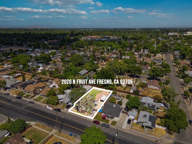 2020 N Fruit Ave, Fresno, CA 93705 - aerial overview of property's location with property parcel outlined and nearby suburban area