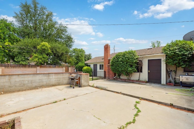2020 N Fruit Ave, Fresno, CA 93705 - back of property with fence and a patio area