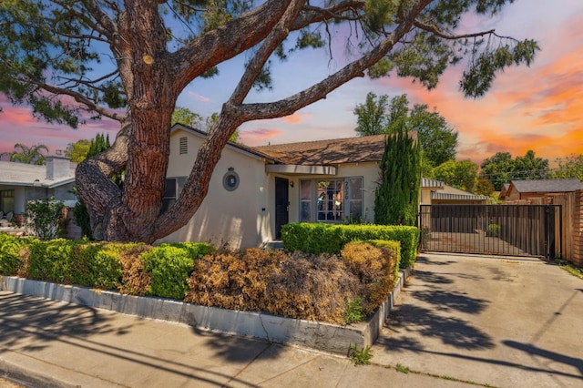2020 N Fruit Ave, Fresno, CA 93705 - view of front facade with stucco siding and a gate