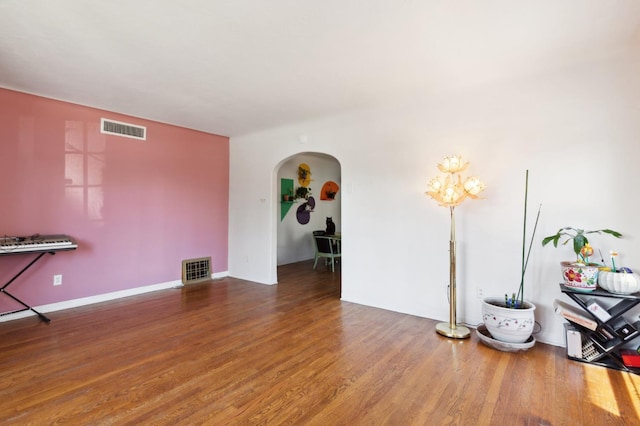 2020 N Fruit Ave, Fresno, CA 93705 - living room featuring arched walkways and wood finished floors