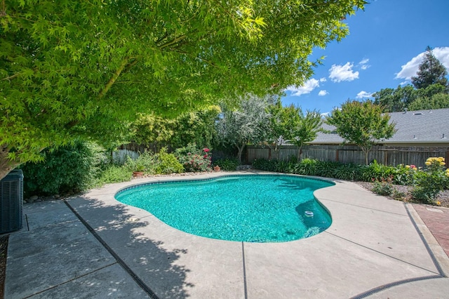 198 Decatur Ave, Clovis, CA 93611 - view of swimming pool featuring a patio, a fenced backyard, and central AC