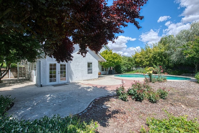 198 Decatur Ave, Clovis, CA 93611 - view of pool featuring french doors, a patio area, and fence