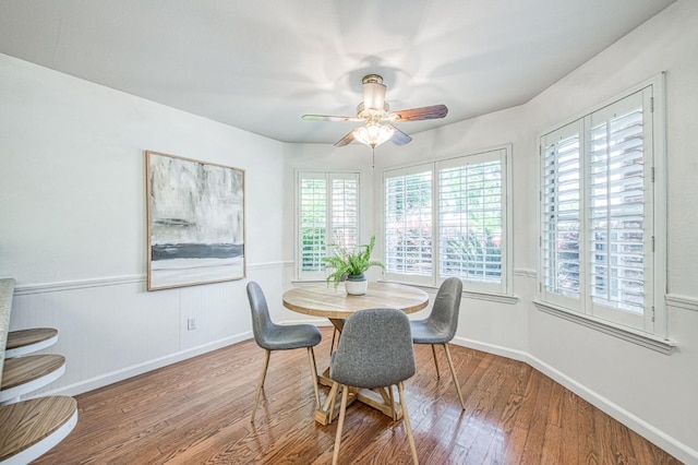 198 Decatur Ave, Clovis, CA 93611 - dining space featuring wood finished floors, a ceiling fan, baseboards, and a wainscoted wall
