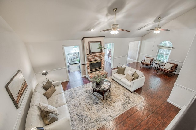 198 Decatur Ave, Clovis, CA 93611 - living area with vaulted ceiling, dark wood-type flooring, a fireplace, ceiling fan, and baseboards