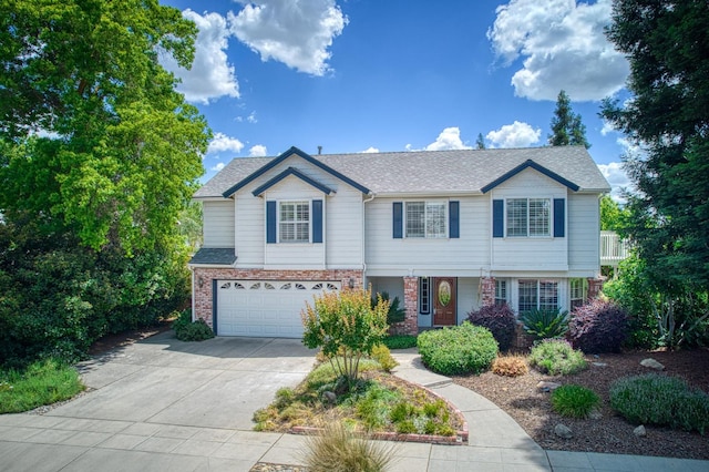 198 Decatur Ave, Clovis, CA 93611 - view of front of home with a garage, driveway, brick siding, and a shingled roof