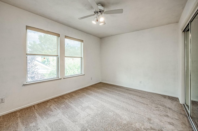 198 Decatur Ave, Clovis, CA 93611 - empty room with carpet floors, ceiling fan, and baseboards