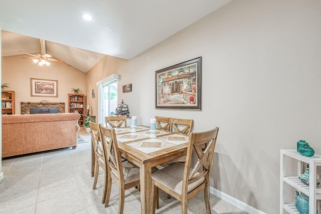 6365 N Barcus Ave, Fresno, CA 93722 - dining area with vaulted ceiling, a ceiling fan, light tile patterned flooring, and recessed lighting
