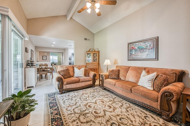 6365 N Barcus Ave, Fresno, CA 93722 - living area with beam ceiling, a ceiling fan, high vaulted ceiling, and light tile patterned floors