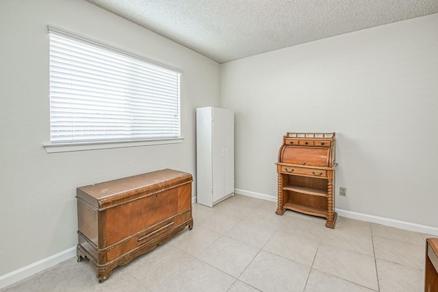 6365 N Barcus Ave, Fresno, CA 93722 - interior space featuring a textured ceiling and baseboards