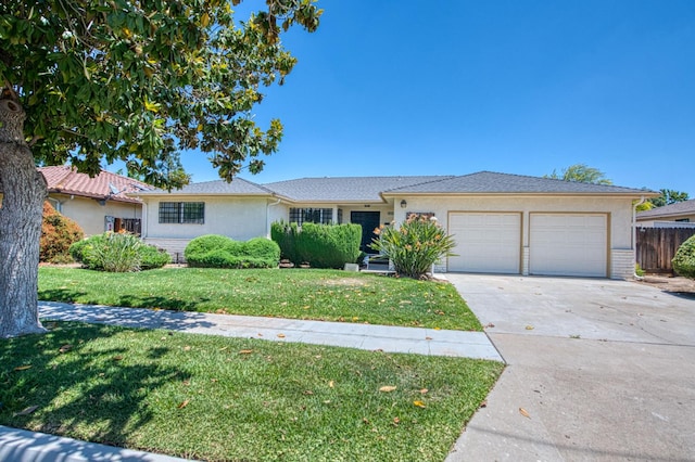single story home featuring an attached garage, concrete driveway, and stucco siding