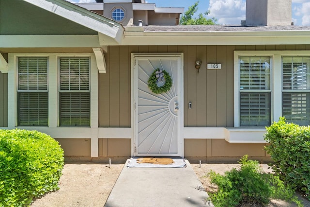doorway to property with board and batten siding