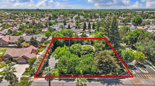 aerial view of residential area with property parcel outlined