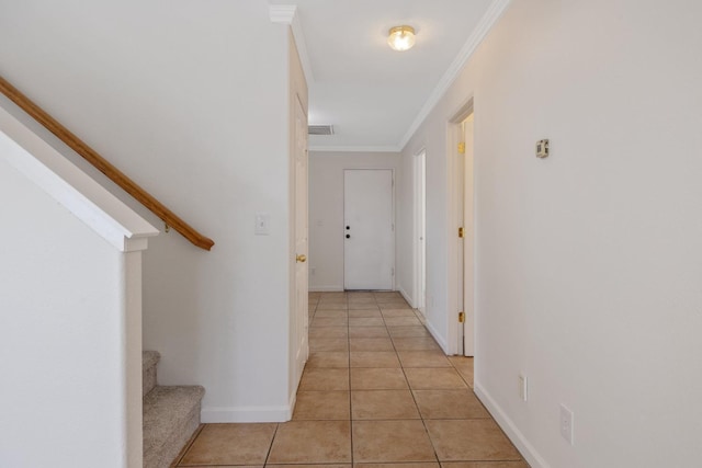 3225 N Mendonca St, Visalia, CA 93291 - hallway with stairs, light tile patterned floors, crown molding, and baseboards