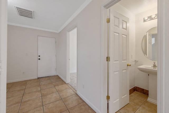 3225 N Mendonca St, Visalia, CA 93291 - corridor with light tile patterned flooring, crown molding, and baseboards