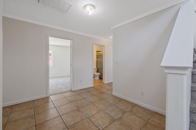 3225 N Mendonca St, Visalia, CA 93291 - spare room with ornamental molding, light tile patterned floors, and baseboards