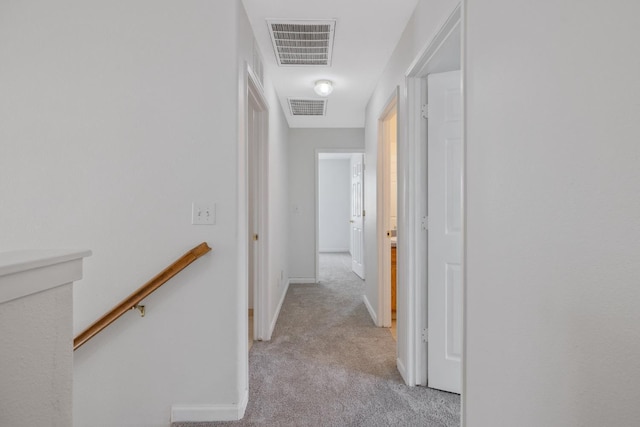 3225 N Mendonca St, Visalia, CA 93291 - hallway with an upstairs landing, light carpet, and baseboards